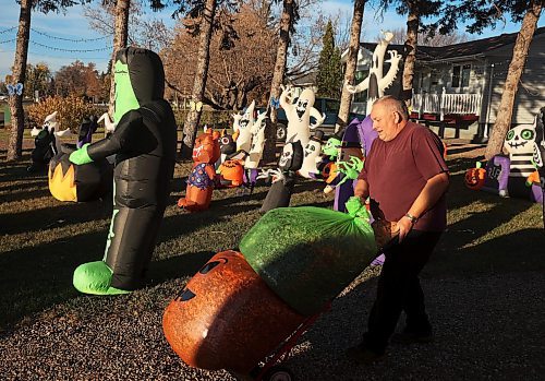 21102024
Tom Muir organizes his extensive Halloween display in the front yard of his home on Lyndale Drive on a beautiful Monday afternoon. Muir has been decorating his home for 23 years and as soon as the Halloween decorations come down, he puts up an equally impressive Christmas display.
(Tim Smith/The Brandon Sun)