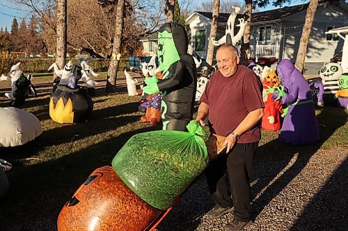 21102024
Tom Muir organizes his extensive Halloween display in the front yard of his home on Lyndale Drive on a beautiful Monday afternoon. Muir has been decorating his home for 23 years and as soon as the Halloween decorations come down, he puts up an equally impressive Christmas display.
(Tim Smith/The Brandon Sun)