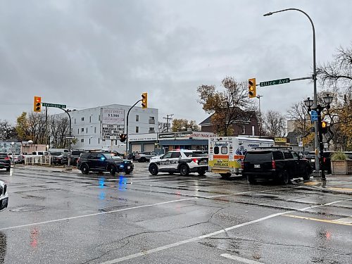 Sherbrook Street and Ellice Avenue was closed to traffic after a man with a gun was seen Tuesday morning. (Ruth Bonneville / Free Press)
