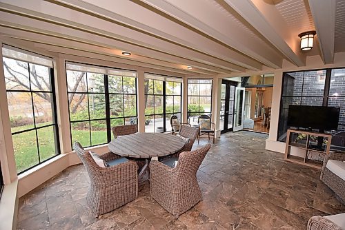 Todd Lewys / Free Press
Set next to the kitchen in the home’s addition, a three-season sunroom with heated floor offers a ground-level view of the backyard and river.