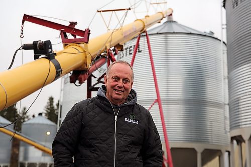 Scott Gray stands on his farm in Erickson, where flax seeds are being lifted into a storage container. He works with his father-in-law and son to farm 3,000 acres every year. (Connor McDowell/Brandon Sun)