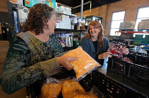 Heather Symbalisty (right) is the incoming executive director with Samaritan House Ministries. She shares a moment with Barbara McNish, out-going executive director,  who has been with the organization for 28 years and recently announced her retirement, effective Dec. 15. (Michele McDougall/The Brandon Sun)

