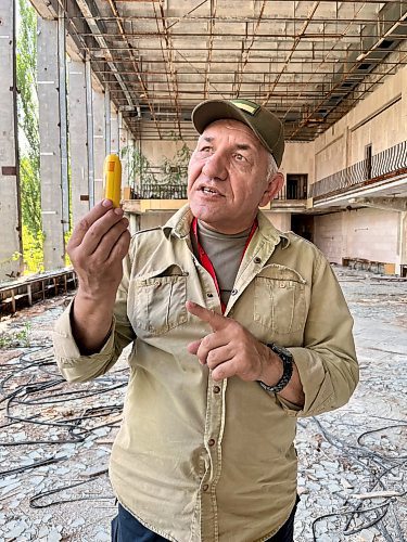 MELISSA MARTIN / FREE PRESS

Volodymyr Verbytskyi, who grew up in Prypiat and still works in the Chornobyl Exclusion Zone, holds up a dosimeter in a second-floor atrium of the city's decaying Palace of Culture. In Soviet cities, the Palace of Culture was a central hub of community life. 

Chornobyl feature - Melissa Martin