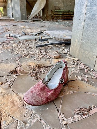 MELISSA MARTIN / FREE PRESS

A woman's shoe, once clad in red velveteen, lies on the floor of Prypiat's Palace of Culture. 

Chornobyl feature - Melissa Martin