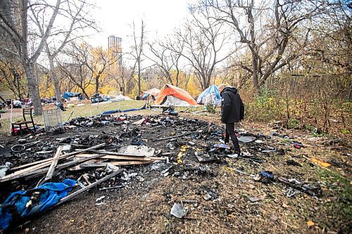 MIKAELA MACKENZIE / FREE PRESS
	
Encampment resident T-Roi B. shows the site of a fire near 37 Balmoral Street on Wednesday, Oct. 23, 2024.

For Joyanne story.
Winnipeg Free Press 2024