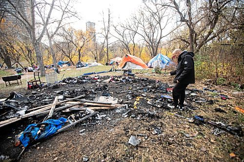 MIKAELA MACKENZIE / FREE PRESS
	
Encampment resident T-Roi B. shows the site of a fire near 37 Balmoral Street on Wednesday, Oct. 23, 2024.

For Joyanne story.
Winnipeg Free Press 2024