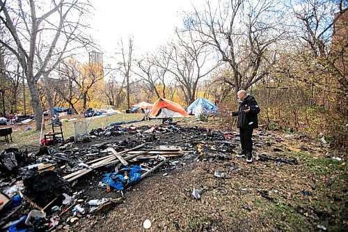 MIKAELA MACKENZIE / FREE PRESS
	
Encampment resident T-Roi B. shows the site of a fire near 37 Balmoral Street on Wednesday, Oct. 23, 2024.

For Joyanne story.
Winnipeg Free Press 2024