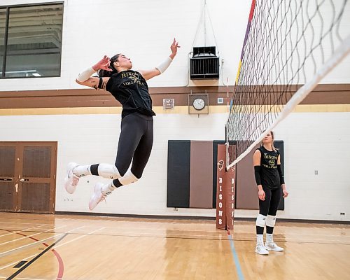 BROOK JONES/FREE PRESS
University of Manitoba women's volleyball player Raya Surinx is back practicing with the Bisons and gearing up for game action after taking a short mental health break. Surinx (left) who is a left side hitter was pictured going up to spike the volleyball as teammate Ella Gray looks on during a team practice inside the Gold Gym at the Frank Kennedy Centre at the University of Manitoba in Winnipeg, Man., Wednesday, Oct. 23, 2024.