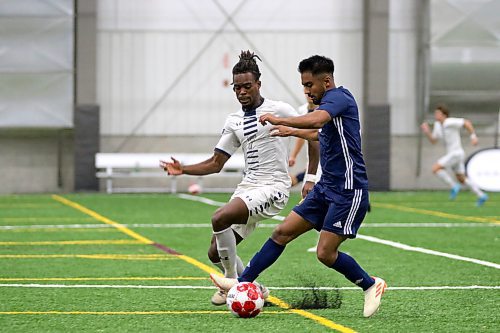 Brandon University Bobcats Rodrigo Melgar, right, battles player of the year Joel Umeh of the Providence Pilots during the MCAC men's soccer semifinals against the Providence Pilots in Winnipeg on Thursday. (Thomas Friesen/The Brandon Sun)