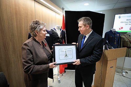 Ruth Bonneville / Free Press

Local - OSI celebrates 20yrs

Photo of Dr. Cyd Courchesne, Director General of Health Professionals and
Chief Medical Officer, Veterans Affairs Canada, honours OSI Director, Chris Zegalski with a special plaque at a special anniversary  ceremony at the centre Thursday. 

The Operational Stress Injury (OSI) clinic at Deer Lodge Centre is marking a milestone
of 20 years of providing specialized outpatient mental health treatment to veterans, Canadian Forces
members and active and former members of the Royal Canadian Mounted Police in Manitoba Thursday. 

See story by Tyler

Oct 24th, , 2024
