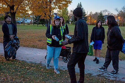 BROOK JONES/FREE PRESS
Sabu's Cubs hand out bottle water to a group of refugees who were playing soccer at Micha&#xeb;lle Jean Park in North Point Douglas in Winnipeg, Man., Wednesday, Oct. 23, 2024.