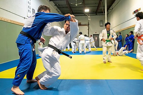 BROOK JONES/FREE PRESS
First degree black belt (shodan) judoka Shogun Laszko, 23, (white judo gi) who is a member of Team Manitoba prepares to throw Michael Akbashev (blue judo gi), 21, who is a member of Canada's national judo team, during a training session at Nakamura Judo in Winnipeg, Man., Thursday, Oct. 24, 2024.