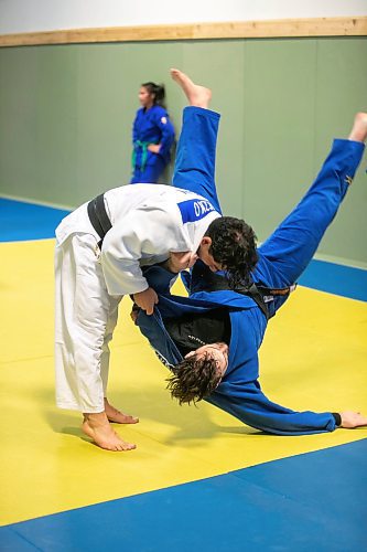 BROOK JONES/FREE PRESS
First degree black belt (shodan) judoka Shogun Laszko (white judo gi), 23, who is a member of Team Manitoba throws Michael Akbashev (blue judo gi), 21, who is a member of Canada's national judo team, during a training session at Nakamura Judo in Winnipeg, Man., Thursday, Oct. 24, 2024.