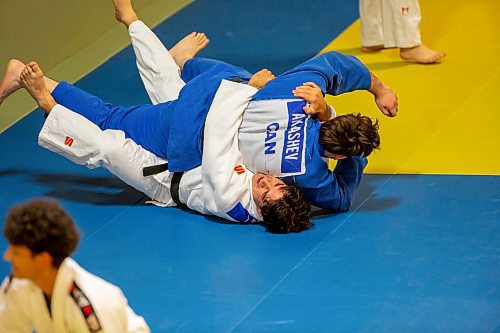 BROOK JONES/FREE PRESS
First degree black belt (shodan) judoka Shogun Laszko (white judo gi), 23,  who is a member of Team Manitoba practicies ground techniques with Michael Akbashev (blue judo gi), 21, who is a member of Canada's national judo team, during a training session at Nakamura Judo in Winnipeg, Man., Thursday, Oct. 24, 2024.