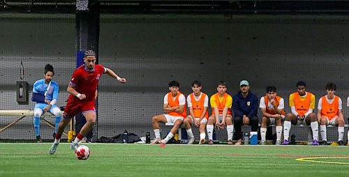 Ibrahim Bezzahou winds up for a free kick in the MCAC men's soccer final. The St. Boniface captain scored the only goal on Matheus Souza, left, who left the game with a shoulder injury a few minutes later. (Thomas Friesen/The Brandon Sun)