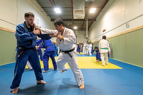 BROOK JONES/FREE PRESS
First degree black belt (shodan) judoka Shogun Laszko (white judo gi), 23,  who is a member of Team Manitoba practices with Michael Akbashev (blue judo gi), 21, who is a member of Canada's national judo team, during a training session at Nakamura Judo in Winnipeg, Man., Thursday, Oct. 24, 2024.