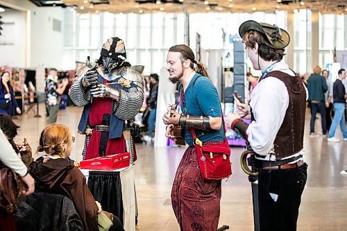 MIKAELA MACKENZIE / FREE PRESS
	
LARPers Daniel Reis (left), Desmond Solstrum, and Kensley MacNair at Comiccon at the RBC Convention Centre on Friday, Oct. 25, 2024.

Standup.
Winnipeg Free Press 2024