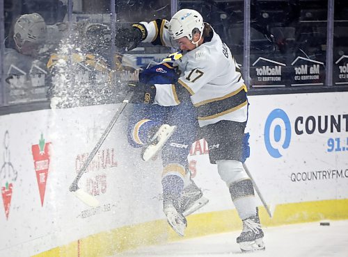 25102024
Joby Baumuller #17 of the Brandon Wheat Kings checks Tanner Molendyk #24 of the Saskatoon Blades into the boards during first period WHL action at Westoba Place on Friday evening.
(Tim Smith/The Brandon Sun)