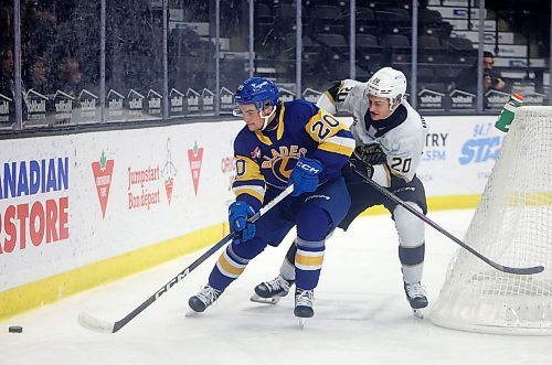 25102024
Ben Binder Nord #20 of the Brandon Wheat Kings and Tyler Parr #20 of the Saskatoon Blades chase the puck behind the Blades net during first period WHL action at Westoba Place on Friday evening.
(Tim Smith/The Brandon Sun)