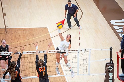 BROOK JONES/FREE PRESS
The University of Manitoba Bisons women's volleyball team hosts the visiting Thompson Rivers WolfPack in Canada West volleyball action at Investors Group Athletic Centre at the University of Manitoba's Fort Garry Campus. Pictured: U of M Bisons left side Raya Surinx spikes the volleyball as Thompson Rivers WolfPack outside Maria Dancheva (No. 19) goes up for the block during second set action.