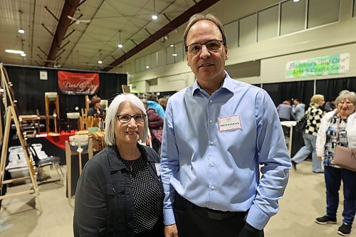 Left: Brandon 'Big One' Art &amp; Craft Sales event coordinator Karen Keilback and Brent. her husband, pose for a picture at the 35th annual sales on Saturday. (Abiola Odutola/The Brandon Sun)