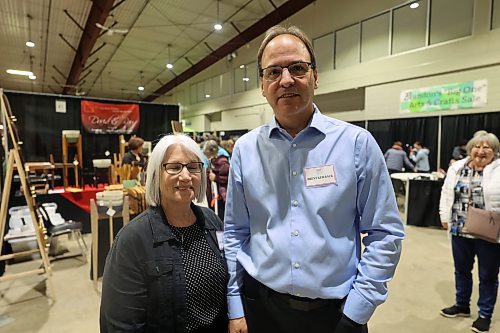 Left: Brandon 'Big One' Art &amp; Craft Sales event coordinator Karen Keilback and Brent. her husband, pose for a picture at the 35th annual sales on Saturday. (Abiola Odutola/The Brandon Sun)