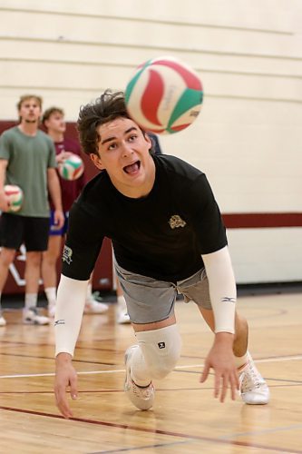 Josh Gamache dives for a ball during Assiniboine College Cougars men's volleyball practice on Monday. (Thomas Friesen/The Brandon Sun)