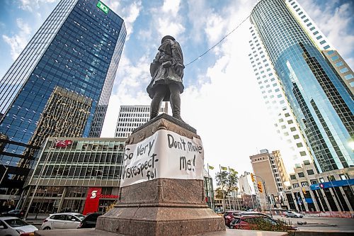 MIKAELA MACKENZIE / FREE PRESS
	
A banner is wrapped around the First World War soldier statue at Portage and Main, which was slated to be moved to Brookside Cemetery, on Monday, Oct. 28, 2024.


Winnipeg Free Press 2024