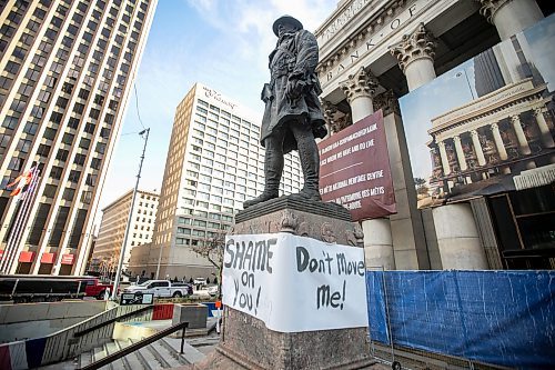 MIKAELA MACKENZIE / FREE PRESS
	
A banner is wrapped around the First World War soldier statue at Portage and Main, which was slated to be moved to Brookside Cemetery, on Monday, Oct. 28, 2024.


Winnipeg Free Press 2024