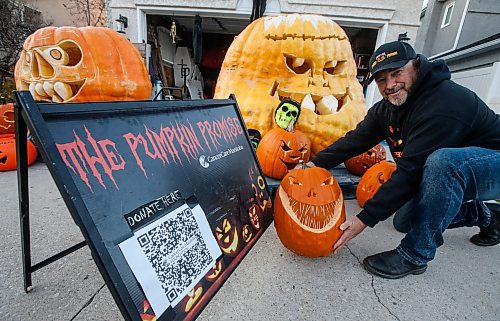 JOHN WOODS / FREE PRESS
Chris Okell, who for years has been decorating donated pumpkins outside his St. Vital home to raise funds for CancerCare Manitoba, sets up his display on his driveway Monday October 28, 2024. Okell was motivated to make and start his Pumpkin Promise charity when his mother Marietta died of pancreatic cancer in 2010.

Reporter: massimo