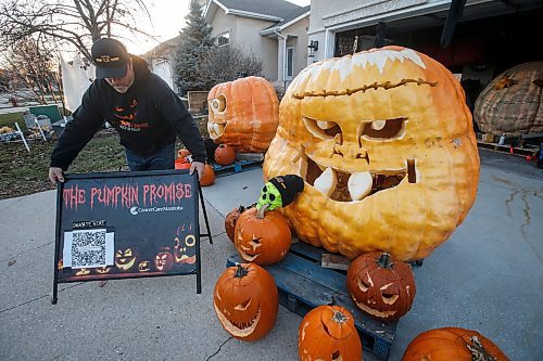 JOHN WOODS / FREE PRESS
Chris Okell, who for years has been decorating donated pumpkins outside his St. Vital home to raise funds for CancerCare Manitoba, sets up his display on his driveway Monday October 28, 2024. Okell was motivated to make and start his Pumpkin Promise charity when his mother Marietta died of pancreatic cancer in 2010.

Reporter: massimo