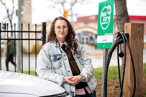 MIKAELA MACKENZIE / FREE PRESS
	
Michelle Panting and one of Peg City Car Co-op&#x2019;s two new electric fleet vehicles (and a new level 11 charging station) in Winnipeg on Tuesday, Oct. 29, 2024.

For Martin Cash story.
Winnipeg Free Press 2024