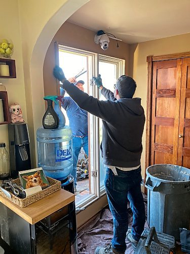 Marc LaBossiere / Free Press
As the new window unit is positioned, the inner jamb is set flush with the neighbouring drywall to ensure proper installation of casings.