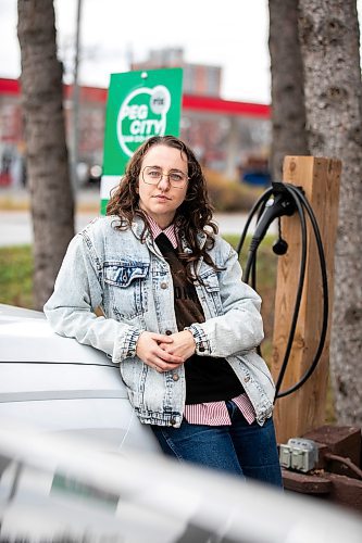 MIKAELA MACKENZIE / FREE PRESS
	
Michelle Panting and one of Peg City Car Co-op&#x2019;s two new electric fleet vehicles (and a new level 11 charging station) in Winnipeg on Tuesday, Oct. 29, 2024.

For Martin Cash story.
Winnipeg Free Press 2024