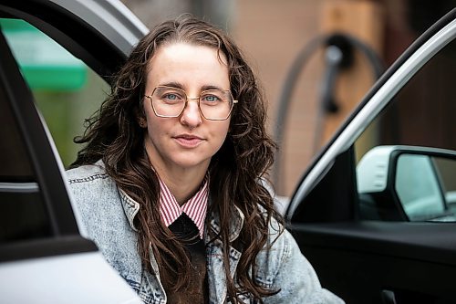 MIKAELA MACKENZIE / FREE PRESS
	
Michelle Panting and one of Peg City Car Co-op&#x2019;s two new electric fleet vehicles (and a new level 11 charging station) in Winnipeg on Tuesday, Oct. 29, 2024.

For Martin Cash story.
Winnipeg Free Press 2024