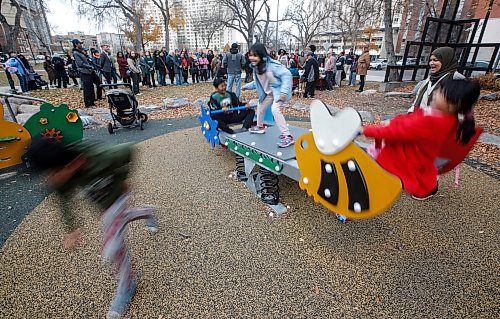 JOHN WOODS / FREE PRESS
Children play on a play structure as politicians and stakeholders hold an opening ceremony of the renovated play structure in Central Park Tuesday October 29, 2024.

Reporter: s/u