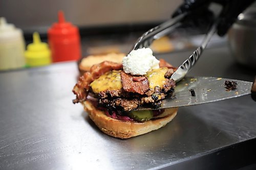 Ruth Bonneville / Free Press

Intersection - woodbine burgers

Photo of Woodbine Burgers signature burger, the SmashZilla, being made.  

Ingredients - Double Waygu Smash Patties Grilled with Red Onions and their signature burger seasoning, Sharp Cheddar Cheese, goat cheese crema, Secret Blueberry Mayo, Raw Red onions, butter pickles, 3 Crispy Onion onions, crispy bacon, Chipotle Mayo, on a butter-toasted brioche bun.

Vellan Vadivelu, owner and head chef of Woodbine Burgers, a new locally made, burger pickup window which specializes in smash burgers.  

Story:  an Intersection piece on Woodbine Burgers that opened in the Spring of this year. Woodbine specializes in smash burgers -  placing what looks like a meatball on the grill, then pressing it with a metal burger stamp to create a thin, crispy patty and adding spices and onions during the frying process. 


They also offer poutines, chicken dishe s and deep-fried Oreos, the latter if you have room for dessert. 

This is for the Sat. Nov. 2 Intersection 

Woodbine Burgers (@woodbineburgers)  Instagram photos and videos

Dave Sanderson story

Oct 29th, , 2024
