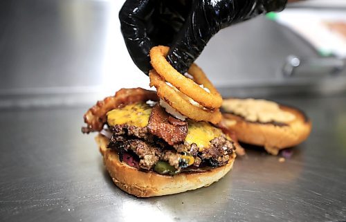 Ruth Bonneville / Free Press

Intersection - woodbine burgers

Photo of Woodbine Burgers signature burger, the SmashZilla, being made.  

Ingredients - Double Waygu Smash Patties Grilled with Red Onions and their signature burger seasoning, Sharp Cheddar Cheese, goat cheese crema, Secret Blueberry Mayo, Raw Red onions, butter pickles, 3 Crispy Onion onions, crispy bacon, Chipotle Mayo, on a butter-toasted brioche bun.

Vellan Vadivelu, owner and head chef of Woodbine Burgers, a new locally made, burger pickup window which specializes in smash burgers.  

Story:  an Intersection piece on Woodbine Burgers that opened in the Spring of this year. Woodbine specializes in smash burgers -  placing what looks like a meatball on the grill, then pressing it with a metal burger stamp to create a thin, crispy patty and adding spices and onions during the frying process. 


They also offer poutines, chicken dishe s and deep-fried Oreos, the latter if you have room for dessert. 

This is for the Sat. Nov. 2 Intersection 

Woodbine Burgers (@woodbineburgers)  Instagram photos and videos

Dave Sanderson story

Oct 29th, , 2024
