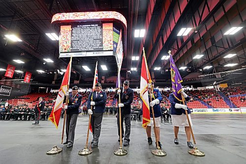 Members of the Colour Guard place their flags before marching out of the arena during Brandon's Remembrance Day ceremony at the Keystone Centre on Saturday. (Matt Goerzen/The Brandon Sun)