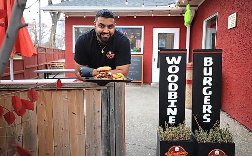 Ruth Bonneville / Free Press

Intersection - woodbine burgers

Outside photo of their patio. 

Vellan Vadivelu, owner and head chef of Woodbine Burgers, a new locally made, burger pickup window which specializes in smash burgers.  

Story:  an Intersection piece on Woodbine Burgers that opened in the Spring of this year. Woodbine specializes in smash burgers -  placing what looks like a meatball on the grill, then pressing it with a metal burger stamp to create a thin, crispy patty and adding spices and onions during the frying process. 

Their signature burger is the SmashZilla - Double Waygu Smash Patties Grilled with Red Onions and their signature burger seasoning, Sharp Cheddar Cheese, goat cheese crema, Secret Blueberry Mayo, Raw Red onions, butter pickles, 3 Crispy Onion onions, crispy bacon, Chipotle Mayo, on a butter-toasted brioche bun.

They also offer poutines, chicken dishe s and deep-fried Oreos, the latter if you have room for dessert. 

This is for the Sat. Nov. 2 Intersection 

Woodbine Burgers (@woodbineburgers)  Instagram photos and videos

Dave Sanderson story

Oct 29th, , 2024
