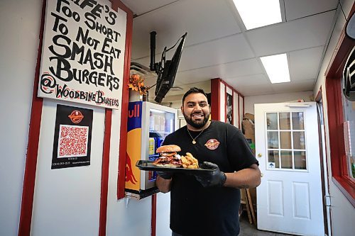 Ruth Bonneville / Free Press

Intersection - woodbine burgers

Photos of Vellan Vadivelu, owner and head chef of Woodbine Burgers, a new locally made, burger pickup window which specializes in smash burgers.  

Story:  an Intersection piece on Woodbine Burgers that opened in the Spring of this year. Woodbine specializes in smash burgers -  placing what looks like a meatball on the grill, then pressing it with a metal burger stamp to create a thin, crispy patty and adding spices and onions during the frying process. 

Their signature burger is the SmashZilla - Double Waygu Smash Patties Grilled with Red Onions and their signature burger seasoning, Sharp Cheddar Cheese, goat cheese crema, Secret Blueberry Mayo, Raw Red onions, butter pickles, 3 Crispy Onion onions, crispy bacon, Chipotle Mayo, on a butter-toasted brioche bun.

They also offer poutines, chicken dishe s and deep-fried Oreos, the latter if you have room for dessert. 

This is for the Sat. Nov. 2 Intersection 

Woodbine Burgers (@woodbineburgers)  Instagram photos and videos

Dave Sanderson story

Oct 29th, , 2024
