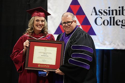 30102024
Assiniboine College Practical Nursing student Sheila Foreman is awarded the Governor General&#x2019;s Academic Medal by Assiniboine College President Mark Frison during the college&#x2019;s fall graduation ceremony at the Keystone Centre on Wednesday. The medal is presented to the graduating diploma program student with the highest overall average. (Tim Smith/The Brandon Sun)