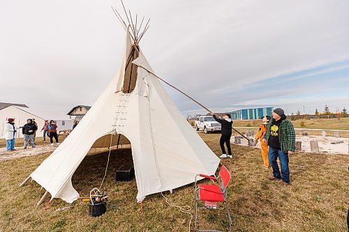 MIKE DEAL / FREE PRESS
Maples Collegiate student, Colby Chartrand-McCorrister, 15, is given direction by Joe Lanceley (right) on installing a smoke flap pole.
Indigenous youth from Maples Collegiate learn to put up and take down a tipi Thursday morning at Ozhaawashkwaa Animikii-Bineshi Aki Onji Kinimaagae&#x2019; Inun, Seven Oaks School Division&#x2019;s land-based learning centre.
There&#x2019;s ever-growing demand for land-based learning and recognition of their important place across the province's public school system. Teachers have increasingly sought elders&#x2019; expertise and planned field trips to sites such as Ozhaawashkwaa Animikii-Bineshi Aki Onji Kinimaagae&#x2019; Inun (Blue Thunderbird Land-based Teachings Learning Centre), also known as the Aki Centre. The Aki Centre spans 50 acres, much of which is undergoing restoration so the over-farmed grounds return to their original state as a tallgrass prairie and wetland, in West St. Paul. The Seven Oaks School Division has facilitated rabbit snaring, moose and deer hyde tanning, and the harvesting of sage, sweetgrass and tobacco, since opening it in 2019. More than 5,000 visitors stopped by the Grassmere Road site that houses vegetable and medicine gardens, a sweat lodge and a greenhouse in 2023-24. In doing so, they learned about ecosystems, treaties, conservation and other related topics.
Reporter: Maggie Macintosh
241031 - Thursday, October 31, 2024.