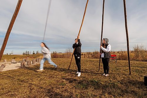 MIKE DEAL / FREE PRESS
Maples Collegiate student, Miley Swan, 15, runs around the tipi to unwind the rope that holds the poles together.
Indigenous youth from Maples Collegiate learn to put up and take down a tipi Thursday morning at Ozhaawashkwaa Animikii-Bineshi Aki Onji Kinimaagae&#x2019; Inun, Seven Oaks School Division&#x2019;s land-based learning centre.
There&#x2019;s ever-growing demand for land-based learning and recognition of their important place across the province's public school system. Teachers have increasingly sought elders&#x2019; expertise and planned field trips to sites such as Ozhaawashkwaa Animikii-Bineshi Aki Onji Kinimaagae&#x2019; Inun (Blue Thunderbird Land-based Teachings Learning Centre), also known as the Aki Centre. The Aki Centre spans 50 acres, much of which is undergoing restoration so the over-farmed grounds return to their original state as a tallgrass prairie and wetland, in West St. Paul. The Seven Oaks School Division has facilitated rabbit snaring, moose and deer hyde tanning, and the harvesting of sage, sweetgrass and tobacco, since opening it in 2019. More than 5,000 visitors stopped by the Grassmere Road site that houses vegetable and medicine gardens, a sweat lodge and a greenhouse in 2023-24. In doing so, they learned about ecosystems, treaties, conservation and other related topics.
Reporter: Maggie Macintosh
241031 - Thursday, October 31, 2024.