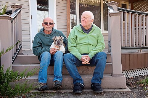 31102024
Lawrence Medd and his father Bill Medd sit with Lawrence&#x2019;s french bulldog Lola at the home they are currently staying at in Killarney. Lawrence is visiting his dad in Killarney from Alberta. Lola woke them in the night Sunday as Bill&#x2019;s duplex went up in flames. The duplex on Finlay Street was completely destroyed in the fire but the Medd&#x2019;s and the duplex&#x2019;s other resident all escaped the blaze. 
(Tim Smith/The Brandon Sun)