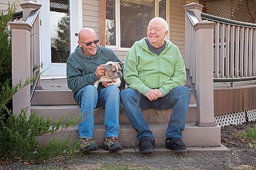 31102024
Lawrence Medd and his father Bill Medd sit with Lawrence&#x2019;s french bulldog Lola at the home they are currently staying at in Killarney. Lawrence is visiting his dad in Killarney from Alberta. Lola woke them in the night Sunday as Bill&#x2019;s duplex went up in flames. The duplex on Finlay Street was completely destroyed in the fire but the Medd&#x2019;s and the duplex&#x2019;s other resident all escaped the blaze. 
(Tim Smith/The Brandon Sun)