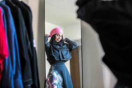 MIKAELA MACKENZIE / FREE PRESS
	
Modest clothing designer Hafsa Altaf poses in some of her hand-painted pieces in her workshop in Winnipeg on Thursday, Oct. 31, 2024.

For AV story.
Winnipeg Free Press 2024