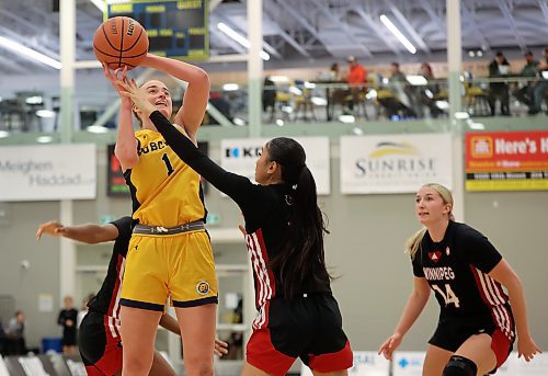 Cali Yates of the Brandon Bobcats leaps to let off a shot on net during their season home opener against the University of Winnipeg Wesmen at the Brandon University Healthy Living Centre on Friday evening. See Bobcats coverage on Page B2. (Tim Smith/The Brandon Sun) 