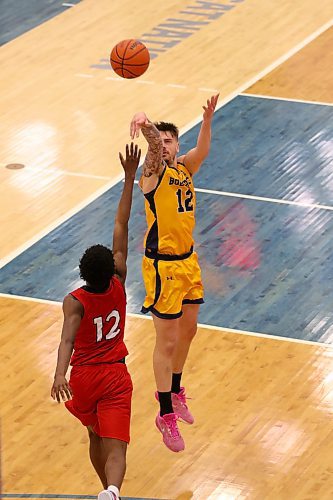 Brandon's Jack McDonald shoots a three-pointer as Winnipeg's Elijah Mensah contests during their Canada West men's basketball game at the Healthy Living Centre on Friday. (Thomas Friesen/The Brandon Sun)