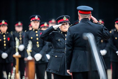 MIKAELA MACKENZIE / FREE PRESS
	
Graduate Kelly Arns salutes acting police chief Gene Bowers during the graduation ceremony for the Winnipeg Police Service recruit class 170 at the RBC Convention Centre in Winnipeg on Friday, Nov. 1, 2024.

Standup.
Winnipeg Free Press 2024